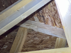 A fractured structural roof truss identified during a pre-drywall 